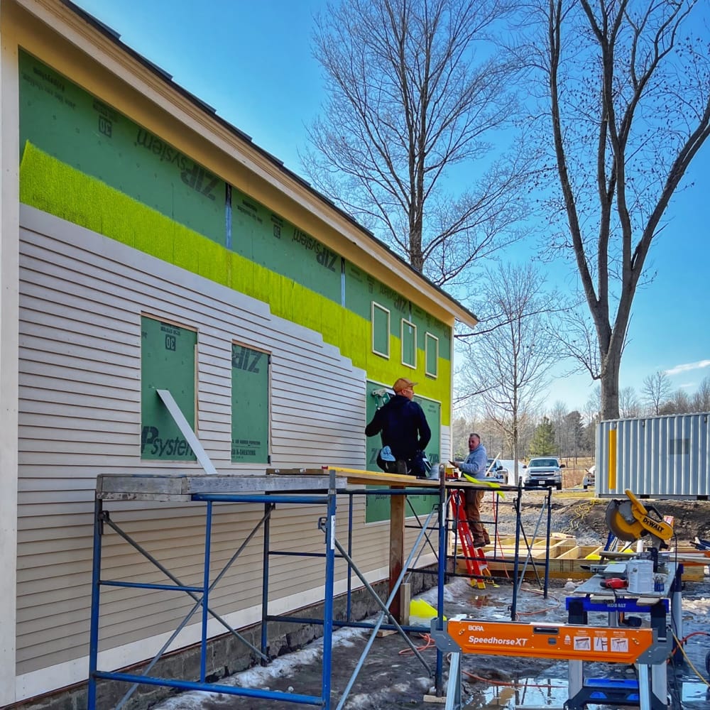 Calvin and Tony Install Clapboard on Icehouse, North Elevation (Photo: R.P. Murphy)
