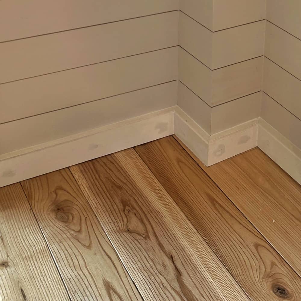 Filling Baseboard Nail Holes (Photo: Glen Gehrkens)