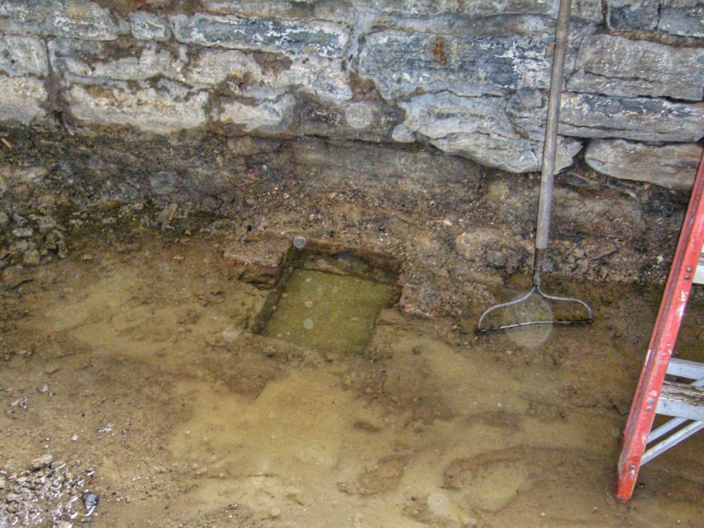 Boggy Basement: Future Wine Cellar Flooded with Water from Gravity Fed Cistern, December 28, 2006​ (Photo: Geo Davis)