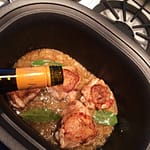 Add a couple cups of dry white wine. The alcohol will cook off but the wine will tenderize the chicken and flavor the marinade.