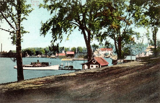 Rosslyn bathhouse, boathouse, and the steam yacht, Kestrel, are center foreground, the Old Dock is center background with Essex Horse Nail Co. Factory at far left. (Source: Shirley LaForest via Essex on Lake Champlain) Rosslyn bathhouse, boathouse, and the steam yacht, Kestrel, are center foreground, the Old Dock is center background with Essex Horse Nail Co. Factory at far left. (Source: Shirley LaForest via Essex on Lake Champlain)