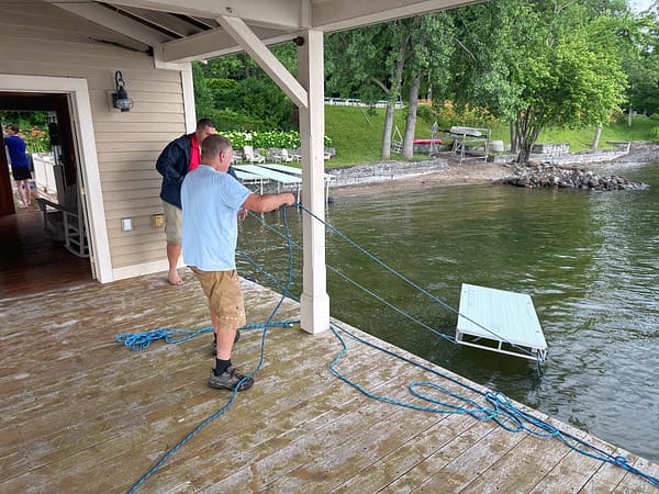 Supi and Calvin Wrangling a Dock Section (Photo: Geo Davis)