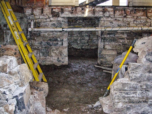 North Elevation with Future Wine Cellar Entrance as Seen Through Gap in Cistern Wall While Busting Out Cistern Walls in Basement, December 29, 2006 (Photo: Geo Davis)