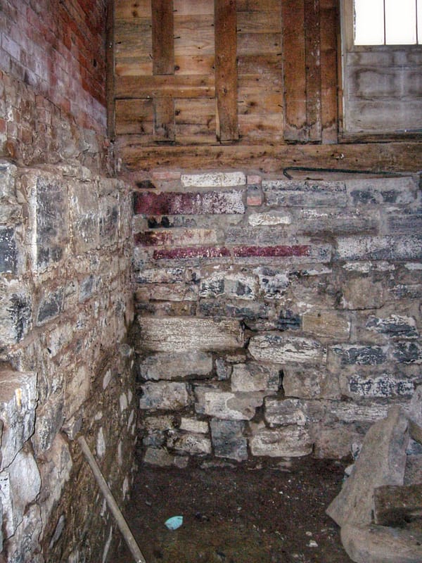 SW Corner of West Elevation While Busting Out Cistern Walls in Basement, December 29, 2006 (Photo: Geo Davis)