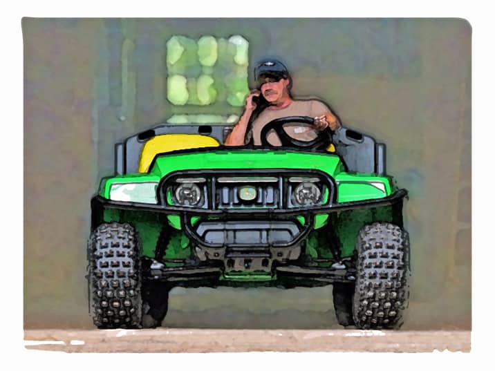 Doug taking care of business on the Gator as he exits Rosslyn carriage barn.